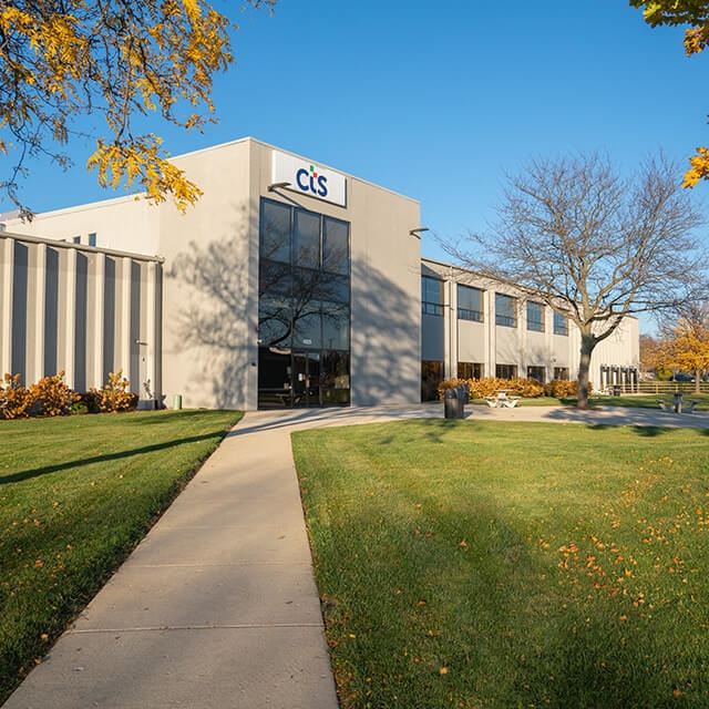 CTS facility with orange colored trees and green grass located in Lisle, IL