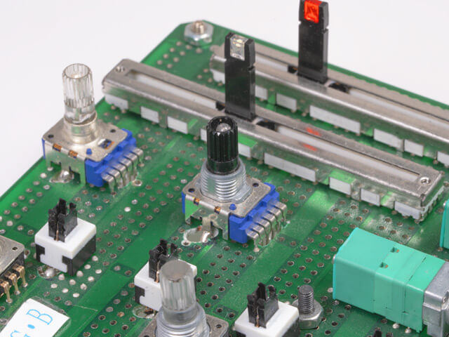 CTS rotary and slide potentiometers mounted on pc board